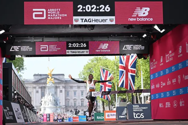 Kenya's Sabastian Sawe crosses the line to win the men's race