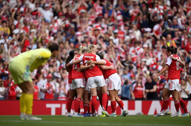 Olivia Smith of Arsenal celebrates scoring her team's second goal with teammates