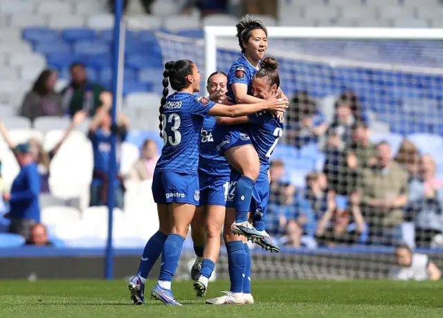 Yuka Momiki of Everton celebrates scoring her team's first goal with teammates