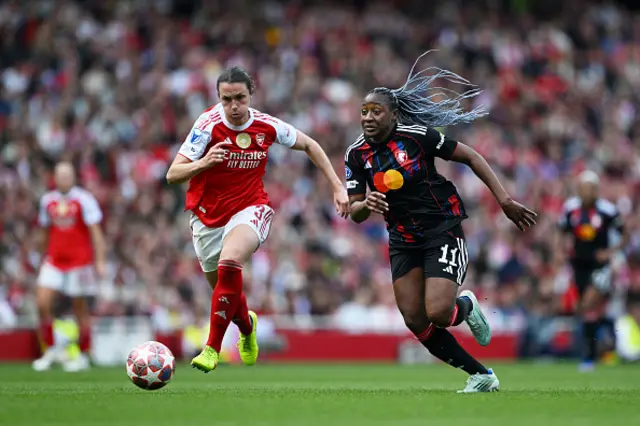 Kadidiatou Diani of OL Lyonnes runs with the ball under pressure from Lotte Wubben-Moy