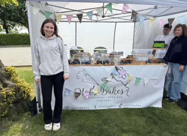 A woman and her cookie stand