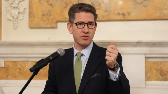 Turner speaking at an event