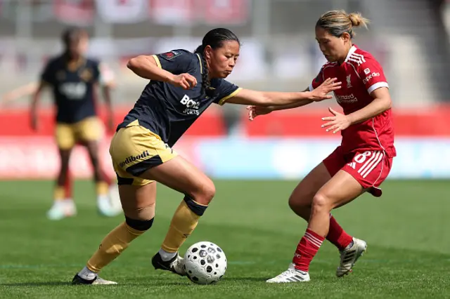 Ylinn Tennebo of West Ham United is challenged by Fuka Nagano of Liverpool