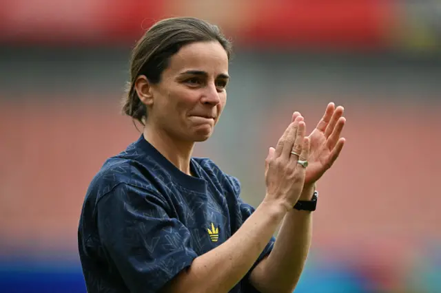 Renee Slegers applauds at the end of time