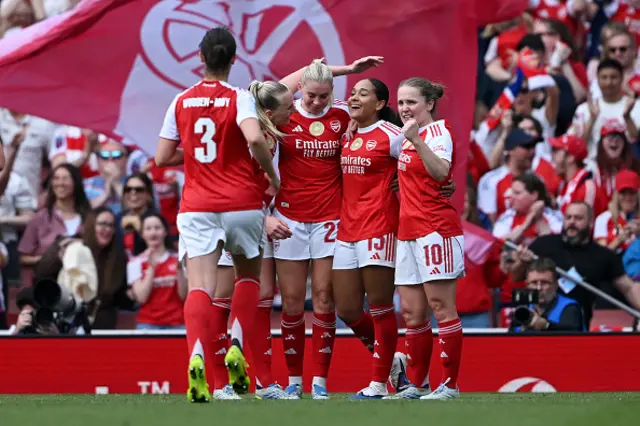 Olivia Smith of Arsenal celebrates scoring her team's second goal with teammates