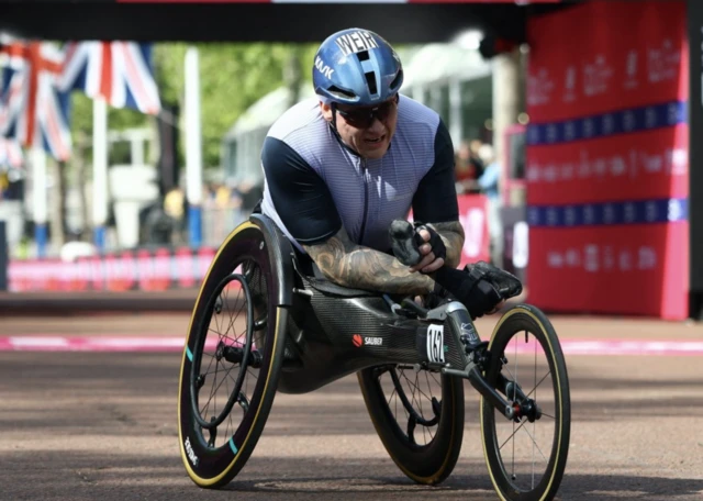 Third placed Britain's David Weir reacts after the men's wheelchair race