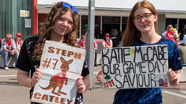 Callie and Callie with their signs