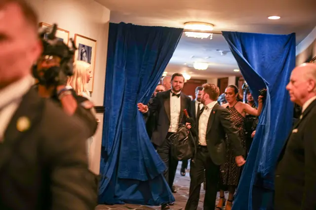 Vice President JD Vance is escorted after an incident at the annual White House Correspondents Association Dinner April 25, 2026 in Washington, DC.