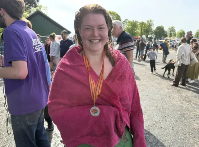 A woman in a pink towel