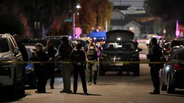 FBI agents and police officers work outside the residence associated with Cole Tomas Allen, the suspect in the shooting incident at the annual White House Correspondents' Association dinner in Washington, D.C., in Torrance, California