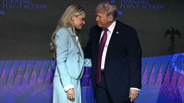 Trump and Erika Kirk at an event, greeting each other