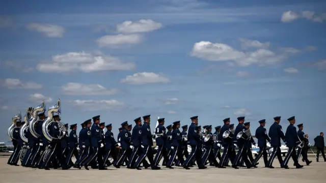 An honor guard approaches after Britain's King Charles and Britain's Queen Camilla landed at Joint Base Andrews, U.S., Maryland, on April 27, 2026