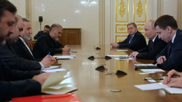 Russian President Vladimir Putin (second from right) and Iran's Foreign Minister Abbas Araghchi at talks in St petersburg, Russia, 27 April