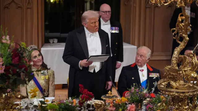 US President Donald Trump delivers his speech as King Charles III and the Princess of Wales listen on either side of him