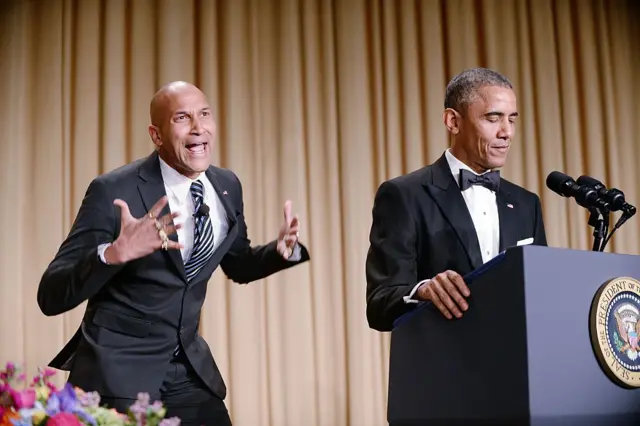 The presidents translator, Luther (L), as portrayed by comedian Keegan-Michael Key, gestures as President Barack Obama speaks at the annual White House Correspondent's Association Gala