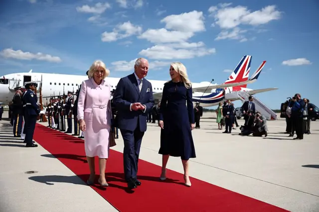 Britain's King Charles III and Britain's Queen Camilla are greeted by US Protocol Chief Monica Crowley as they arrive at Joint Base Andrews, Maryland,.