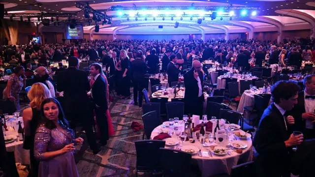 Attendees are seen inside the ballroom after shots were reportedly fired during the White House Correspondents' dinner at the Washington Hilton in Washington, DC, on April 25, 2026.