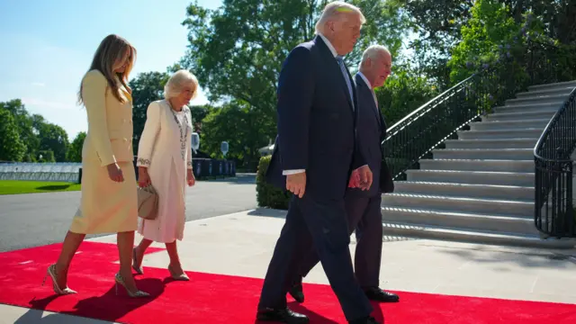 President Trump and King Charles walking into the White House with the First Lady and Queen Camilla behind