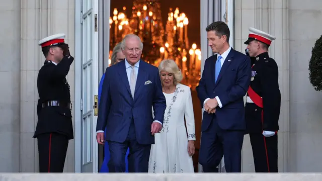 King Charles III and British Ambassador to the US Christian Turner exit the British Embassy