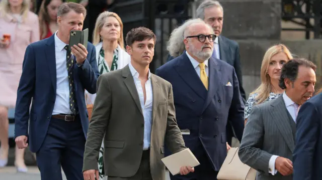 Retired Olympic diver Tom Daley leaves the British ambassador's residence after attending a garden party in honor of Britain's King Charles and Queen Camilla during their visit to the United States, in Washington, D.C., U.S., April 27, 2026.