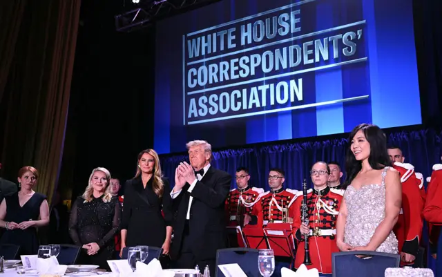 (L/R) Journalist Karen Travers, White House Press Secretary Karoline Leavitt, US First Lady Melania Trump, US President Donald Trump and CBS News senior White House correspondent Weijia Jiang attend the White House Correspondents' dinner
