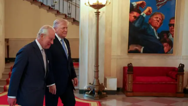 U.S. President Donald Trump and Britain's King Charles walk together