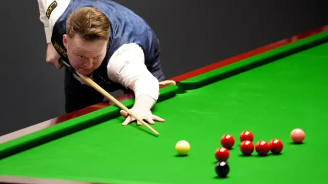 Shaun Murphy plays a shot