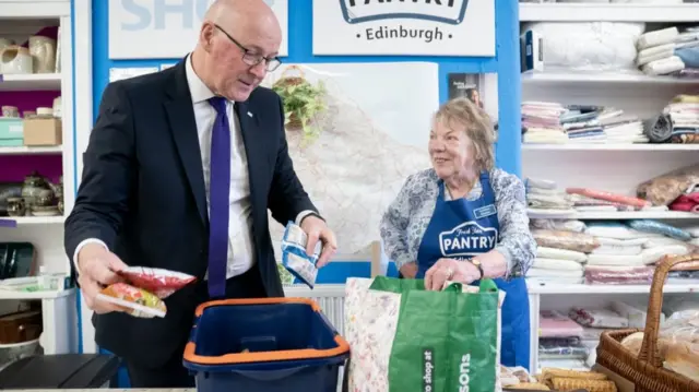 SNP leaderJohn Swinney with volunteer Eleanor Hume during a visit to Fresh Start Pilton, Edinburgh