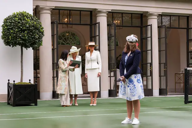 A student wears a virtual reality headset as Queen Camila and First lady Melania Trump attend a cross-cultural educational event at the White House