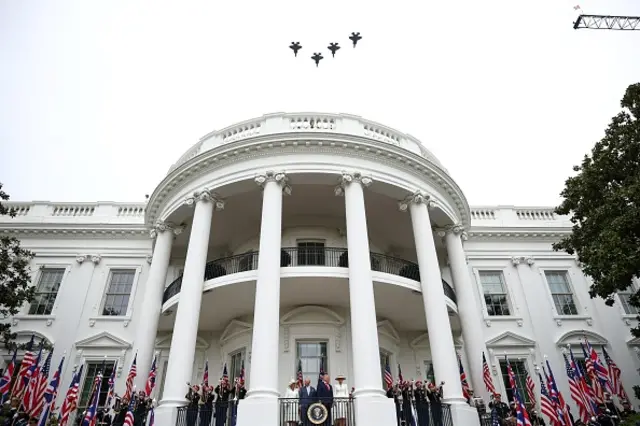 Four military jets fly over the White House.