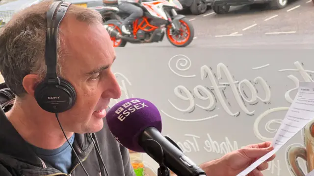 Ben Fryer speaks to Zack Polanski from a afe in Halstead in Essex