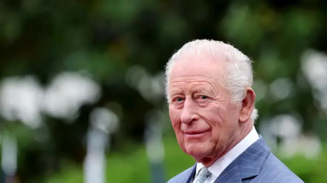 A close-up head and shoulders shot of King Charles III looking to his left