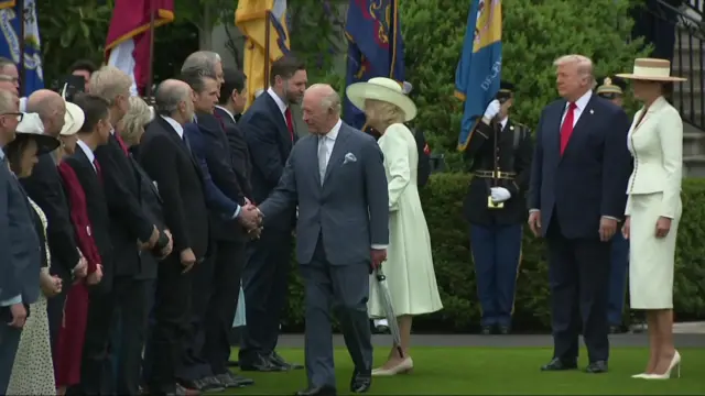King and Queen shake hands with American officials