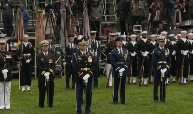 People in military uniform at the White House.