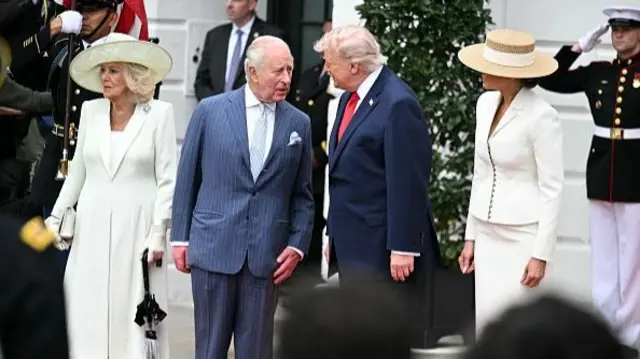 Camilla, the King, Donald Trump and Melania Trump standing outside the White House