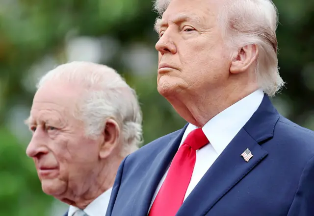 Donald Trump standing next to King Charles