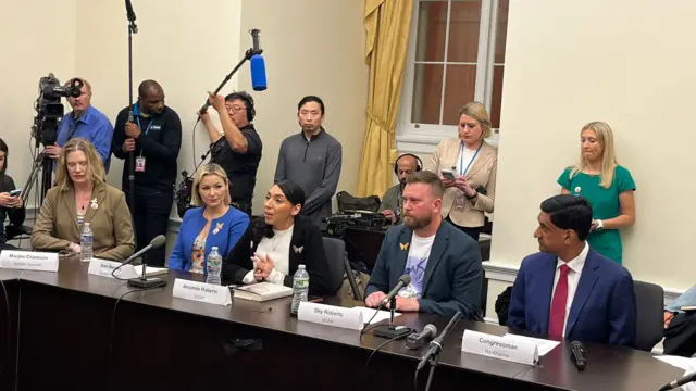 Sky Roberts (Virginia Giuffre's brother, second from right) and his wife Amanda Roberts (third from left) speak at round table