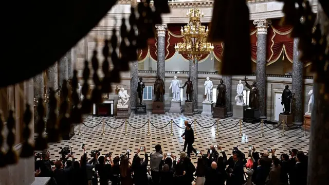 King and Mike Johnson walk through the Capitol building