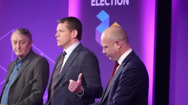 Rhun ap Iorwerth stands between Anthony Slaughter and Dan Thomas