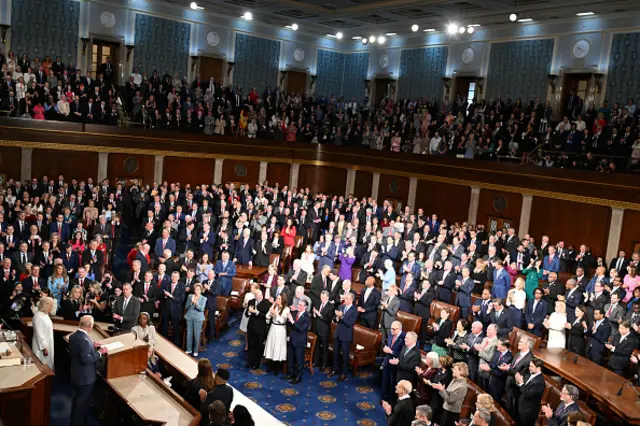 The crowd in the House clapping as Charles speaks