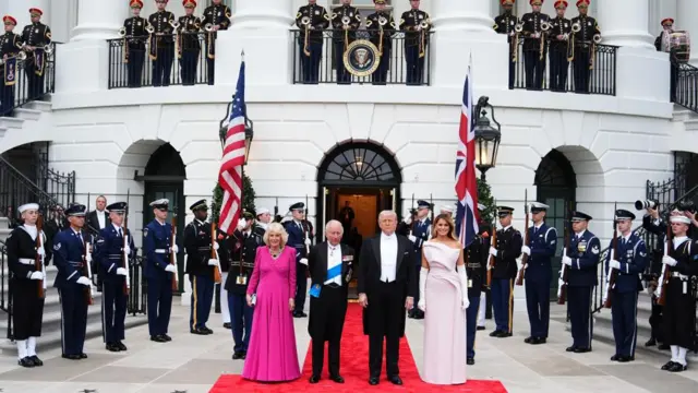 A military guard surround the King, Queen, Donald and Melania Trump