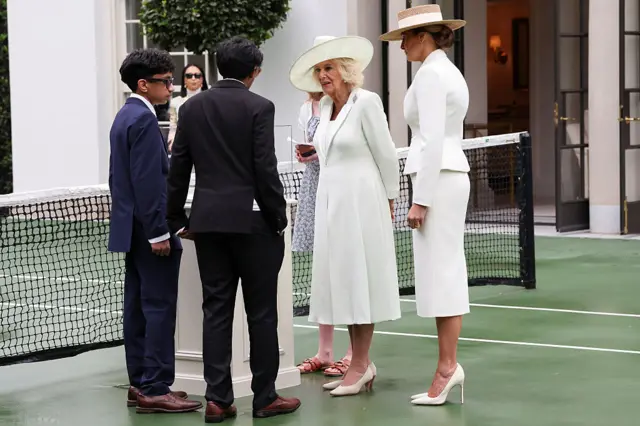 First lady Melania Trump and Britain's Queen Camilla watch students using AI-enabled glasses as they take part in a cultural educational event at the White House