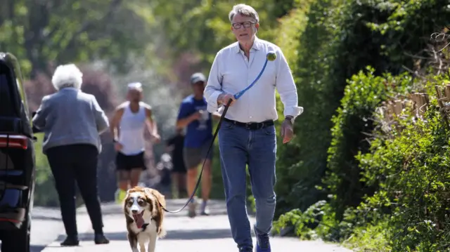 Former UK Ambassador to the US, Peter Mandelson, walks his dog near his home in London, Britain, 27 April 2026.