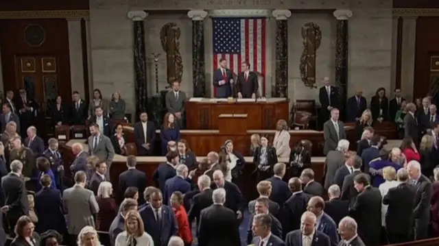 The US House chamber full of people waiting for the King to arrive.