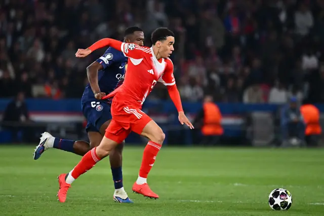 Jamal Musiala running with the ball