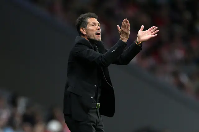 Atletico Madrid boss Diego Simeone applauds.