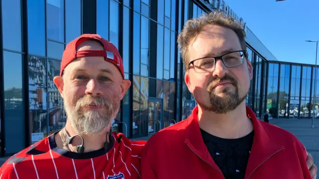 Two men in red jerseys