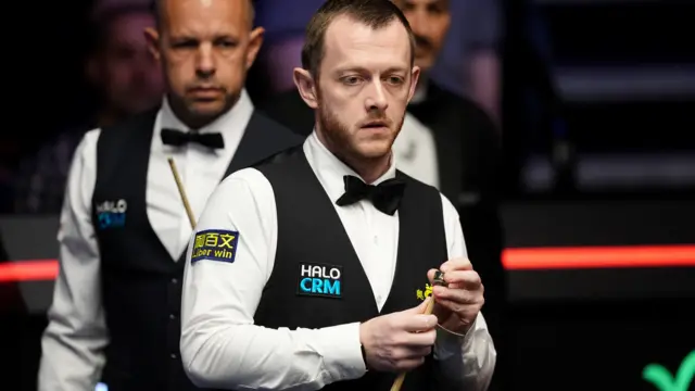 Mark Allen chalks his cue