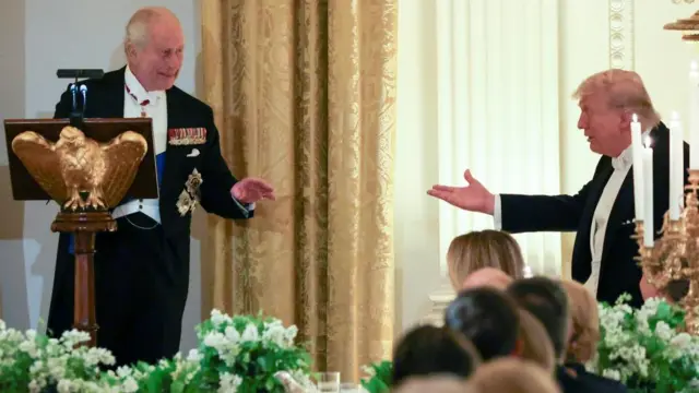 Charles and Trump gesture