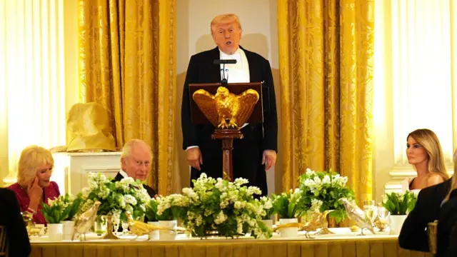 Donald Trump speaking at a state dinner, alongside Queen Camilla, King Charles and Melania Trump